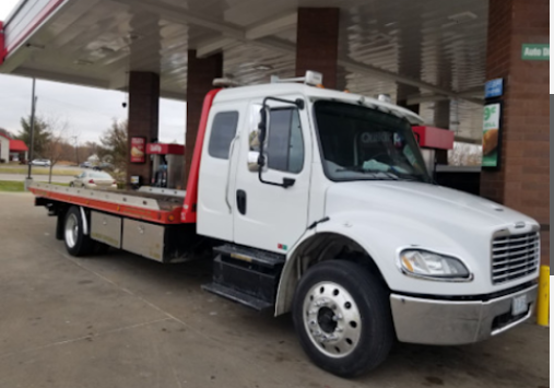 Professional flatbed tow truck in fleet